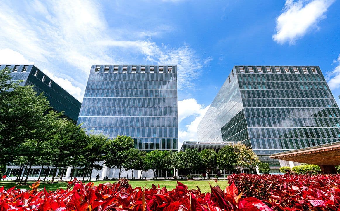 Helios Business Park exterior with vibrant greenery